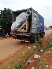 Open shipping container with agricultural equipment inside